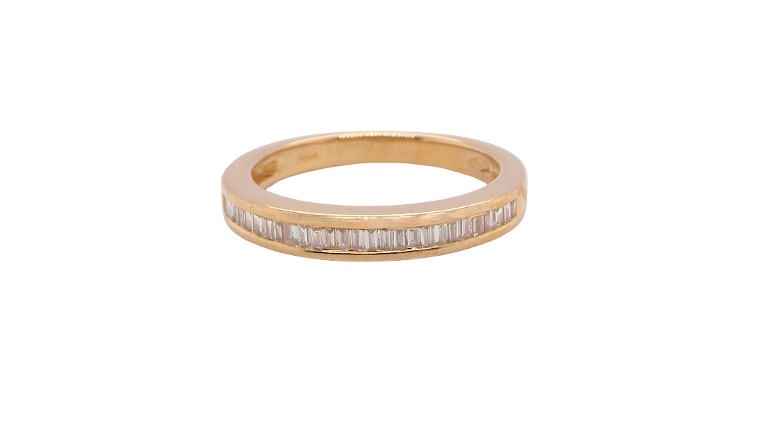 An 18ct gold baguette diamond eternity ring