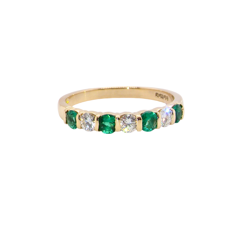 Emerald and diamond half eternity ring