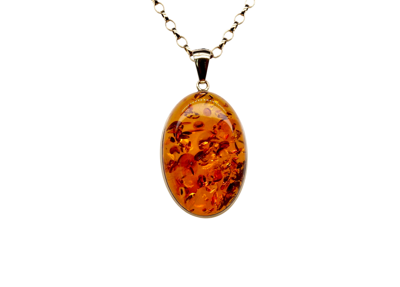 Amber pendant necklace on a white background