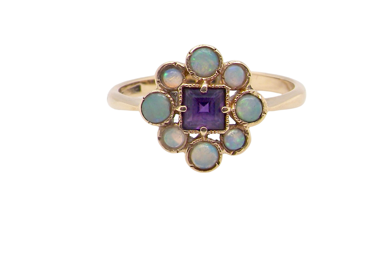 An Amethyst and Opal dress ring