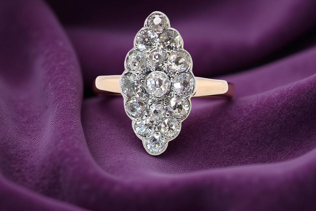 An Antique Marquise shaped Diamond Cluster Ring