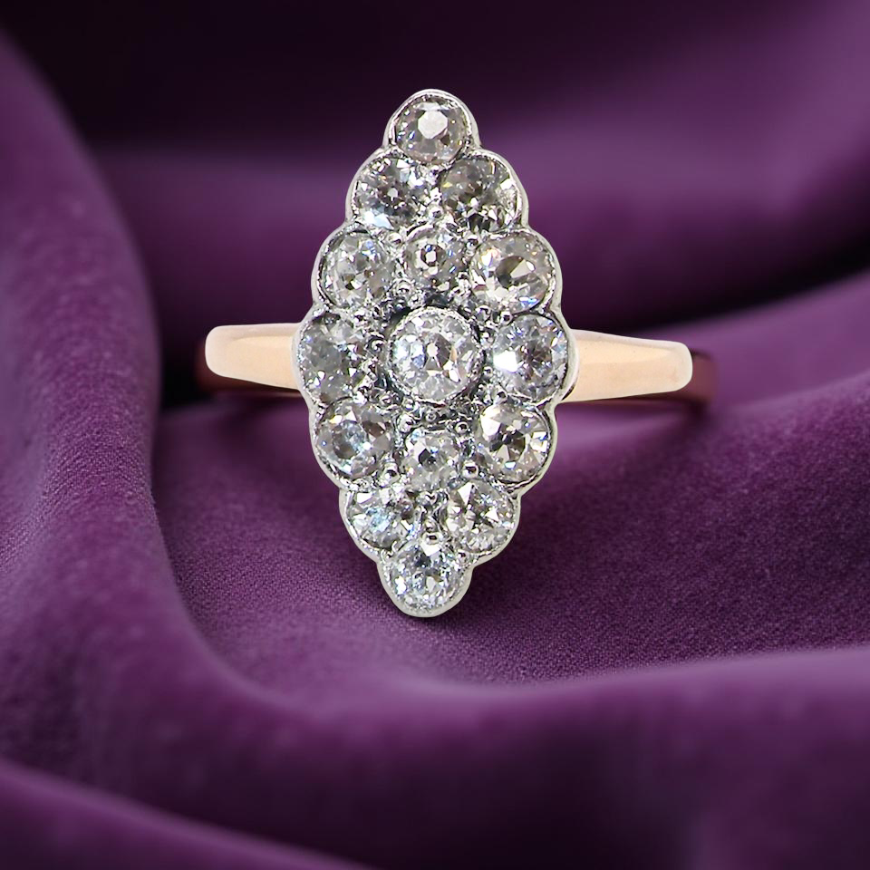 An Antique Marquise shaped Diamond Cluster Ring