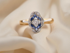 An Art Deco Diamond and Sapphire Cluster Ring (1920-1930)