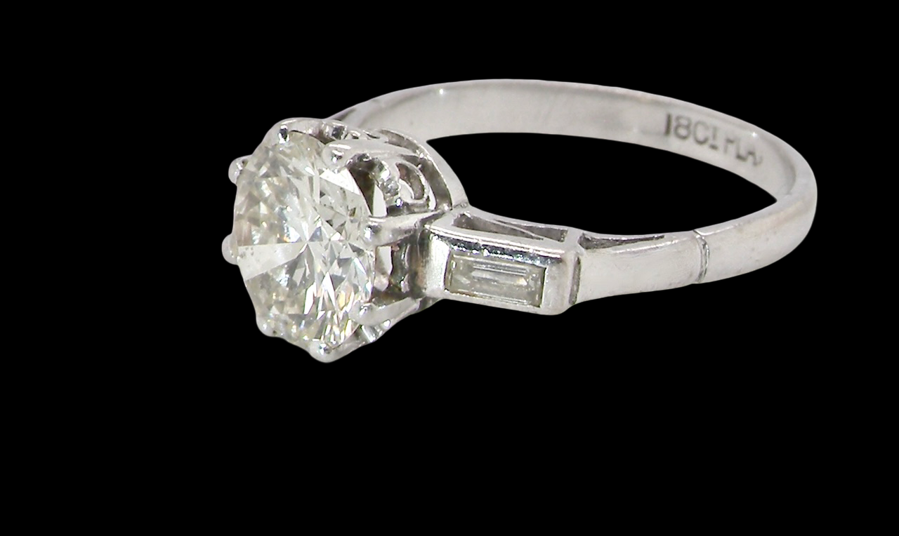 An Art Deco solitaire ring showcasing a beautiful 1.75 carat diamond side