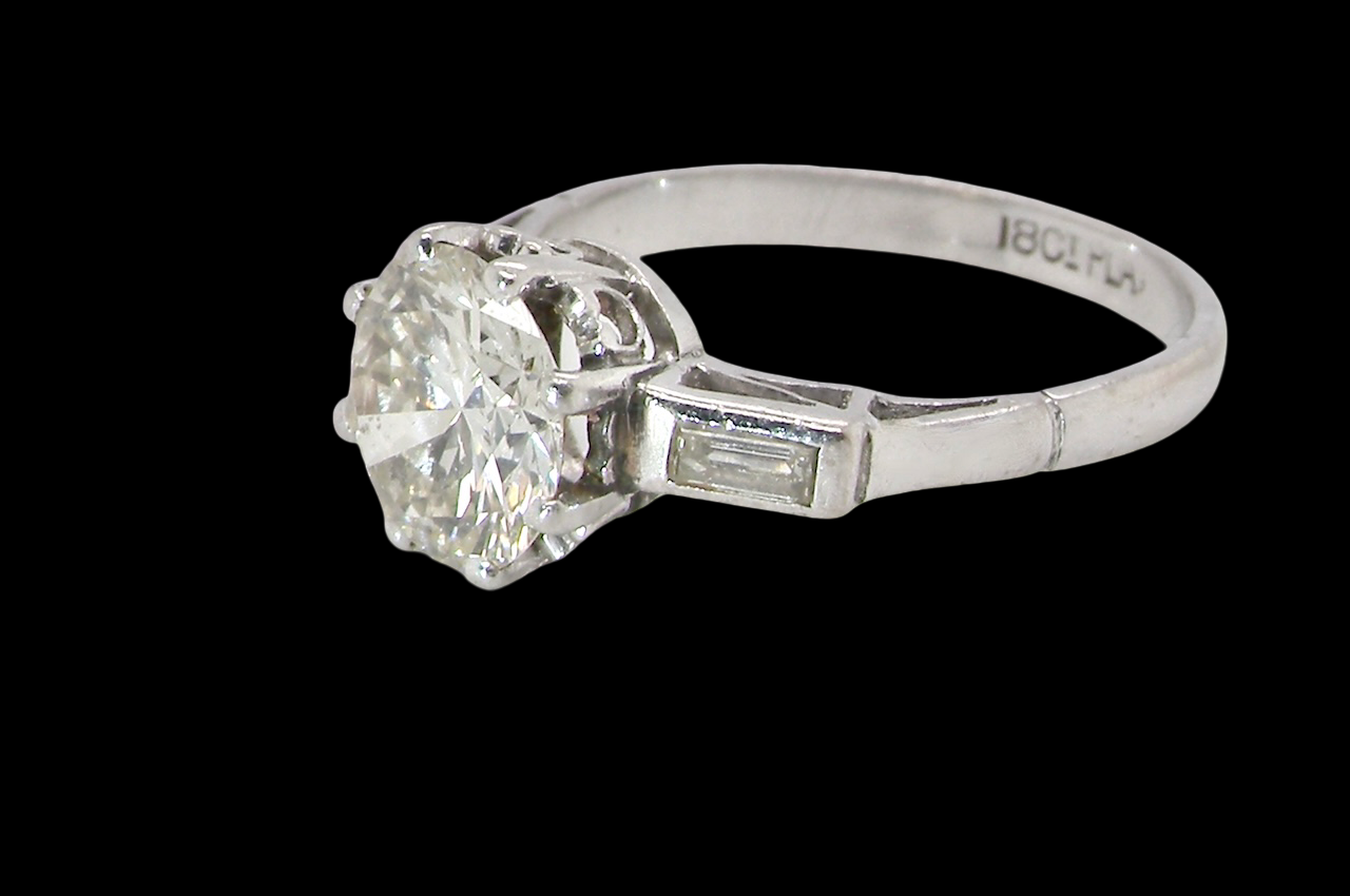 An Art Deco solitaire ring showcasing a beautiful 1.75 carat diamond side