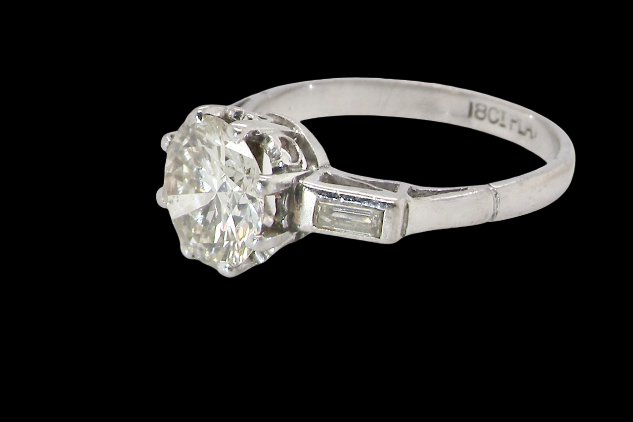 An Art Deco solitaire ring showcasing a beautiful 1.75 carat diamond side