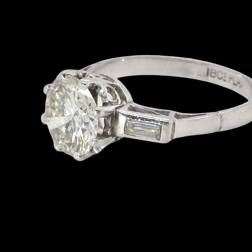 An Art Deco solitaire ring showcasing a beautiful 1.75 carat diamond side