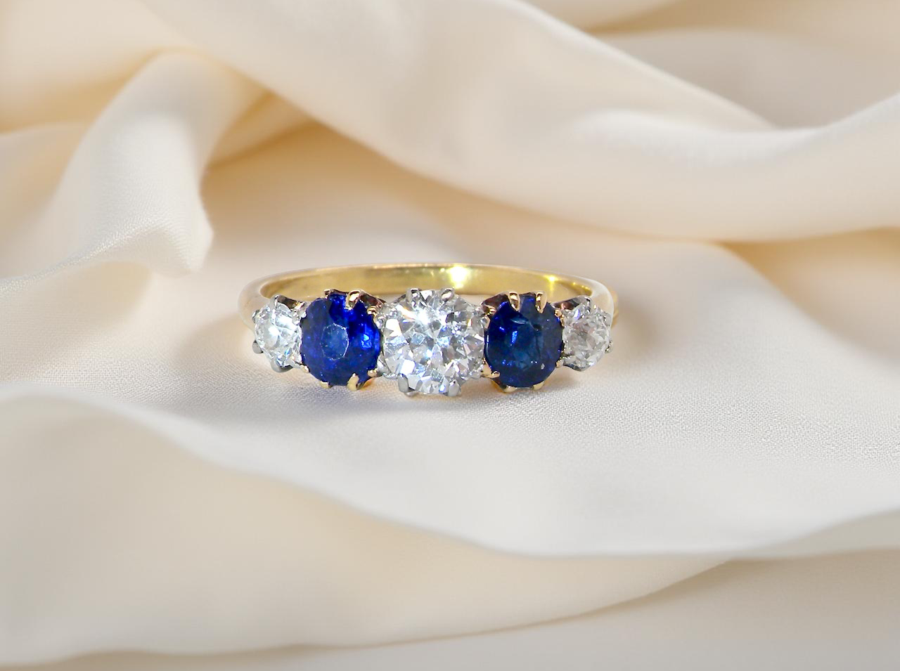 An Early 20th Century 5 Stone Diamond and Sapphire Ring