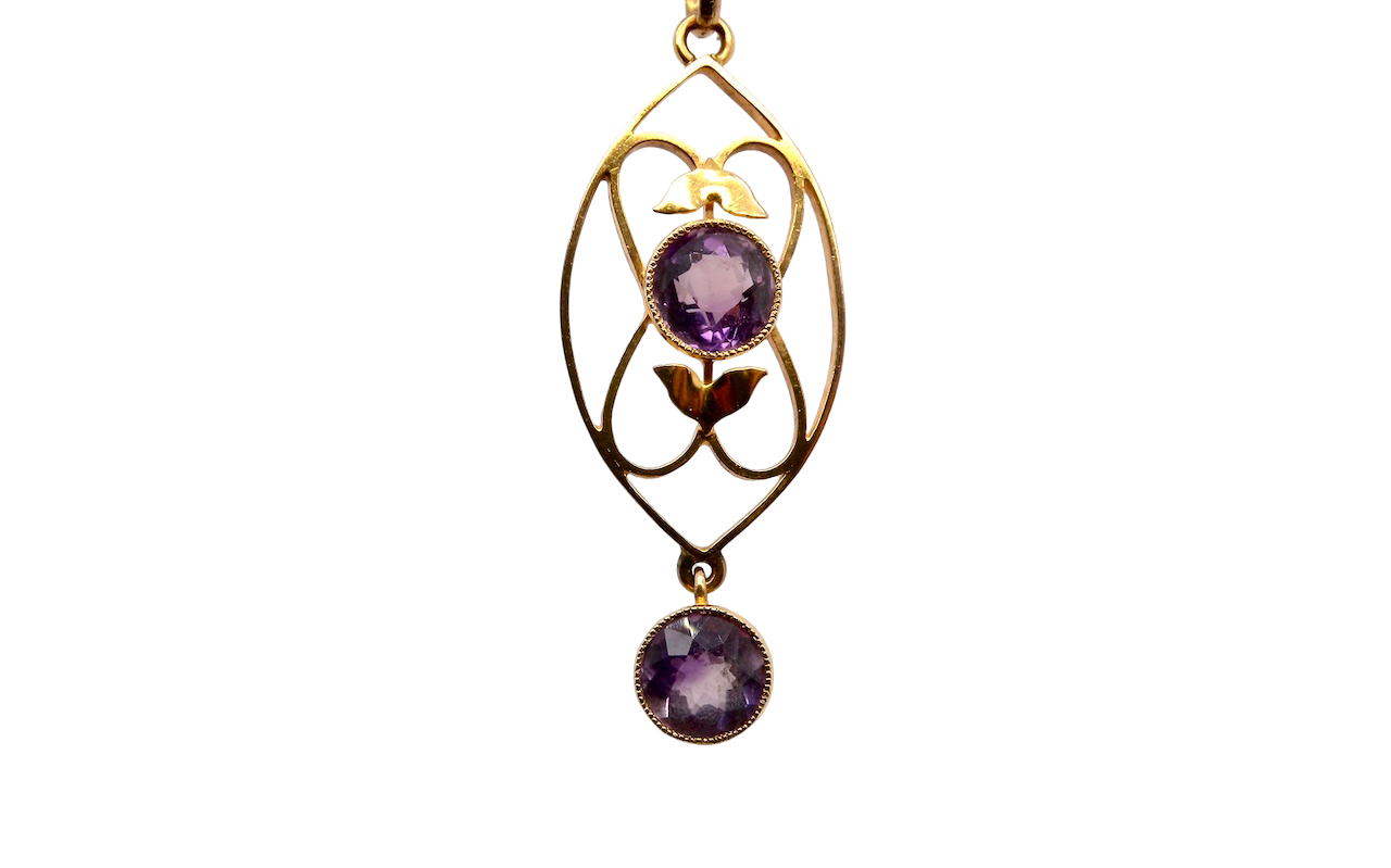 An Edwardian pendant set with two amethyst