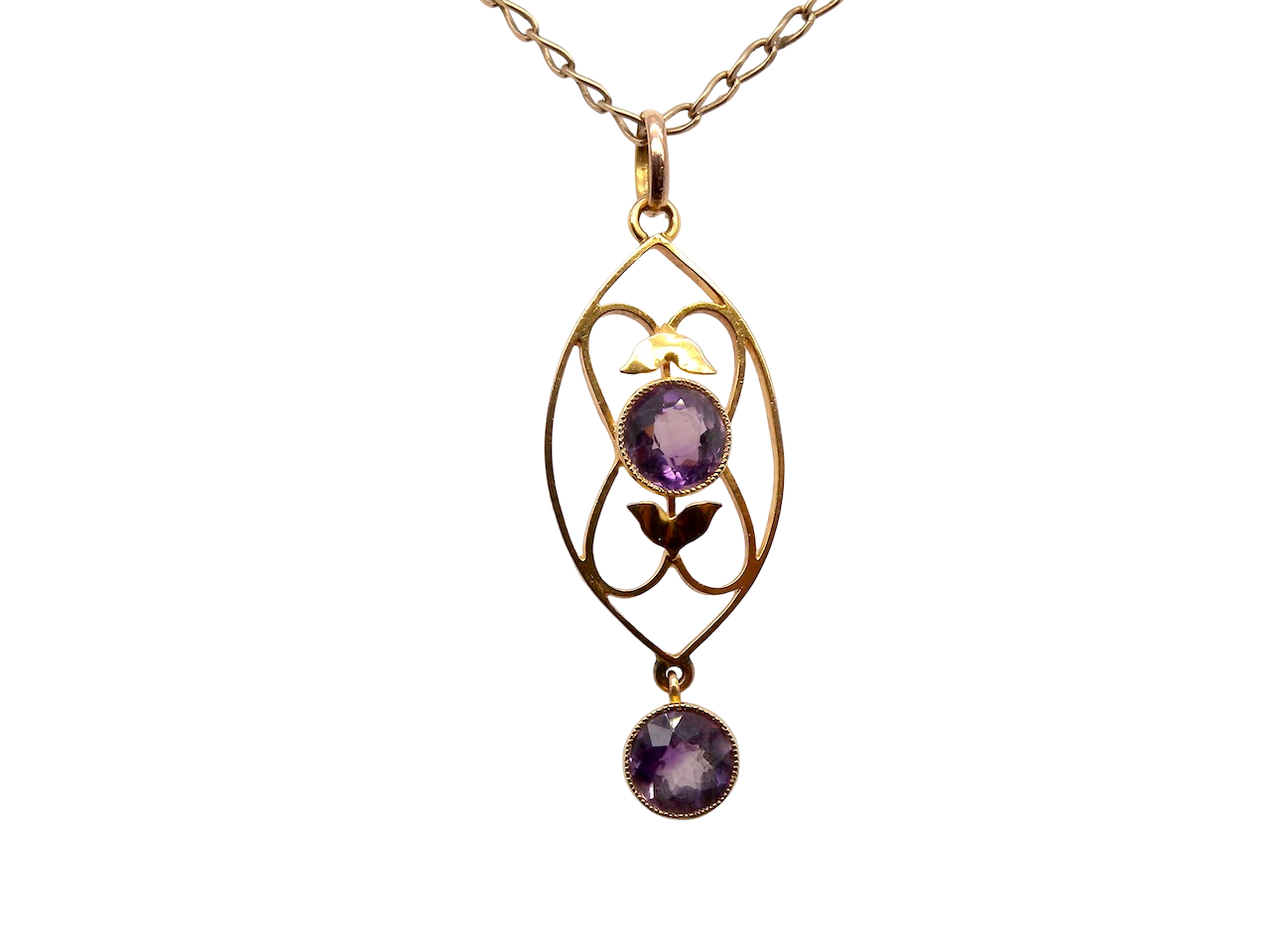 An Edwardian pendant set with two amethyst gemstones