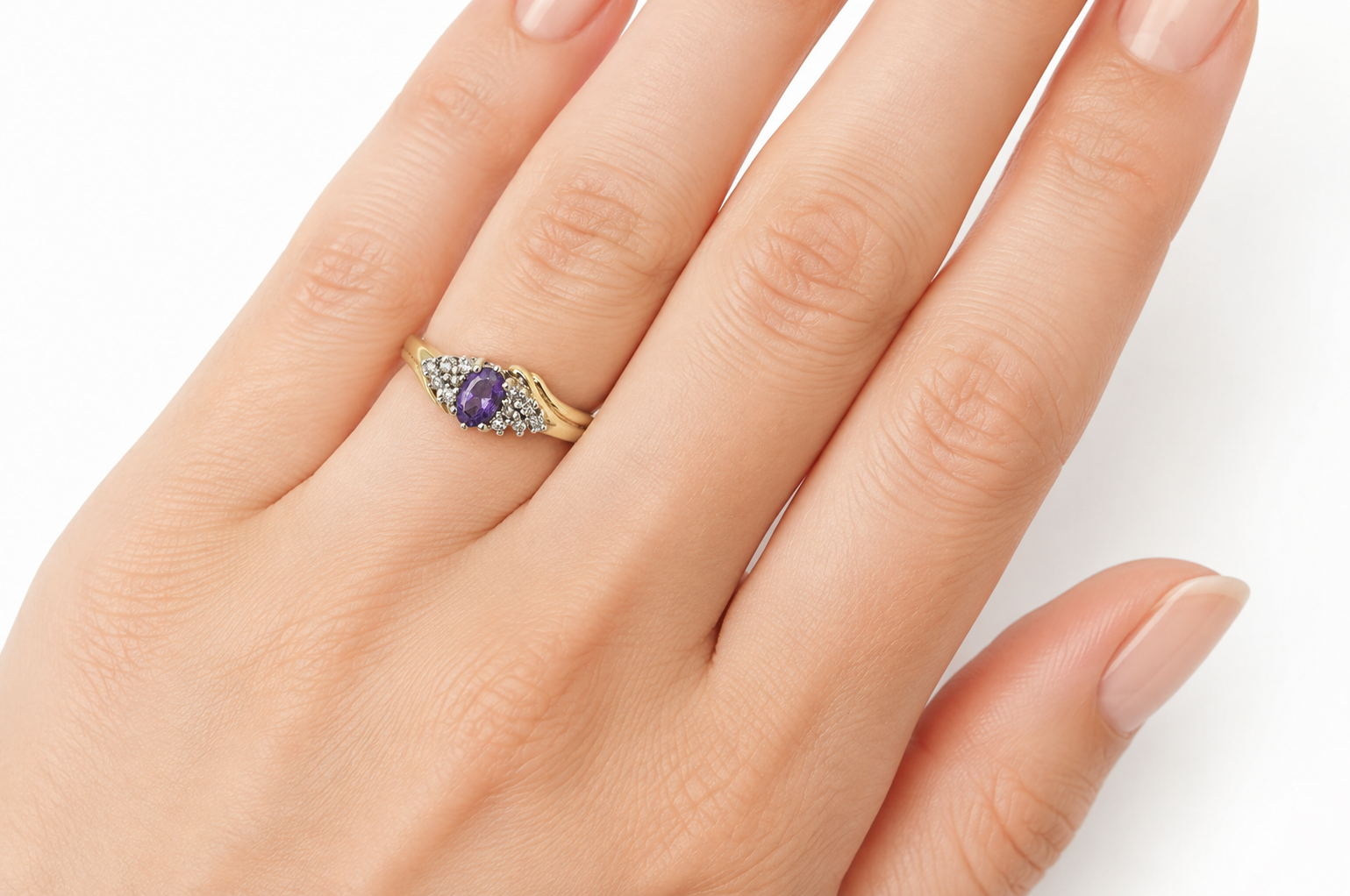 Marquise amethyst and diamond ring on a hand