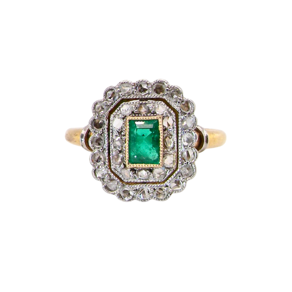 An antique Emerald and Diamond cluster ring
