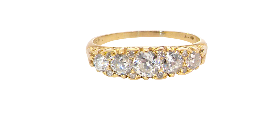An antique boat shaped five stone ring. Set with five old cut white diamonds. Centre 5mm (0.45-0.50 carats) each side a 4mm stone, at each end a 2.4mm stone.