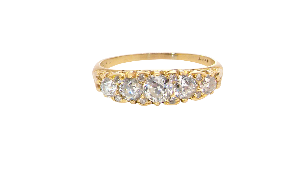 An antique boat shaped five stone ring. Set with five old cut white diamonds. Centre 5mm (0.45-0.50 carats) each side a 4mm stone, at each end a 2.4mm stone.