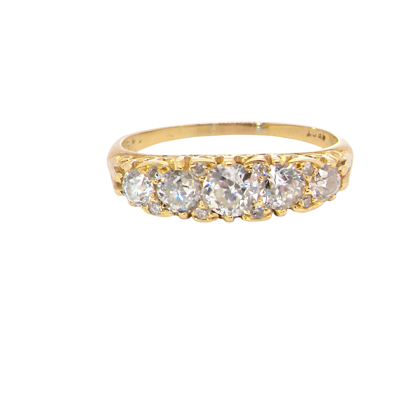 An antique boat shaped five stone ring. Set with five old cut white diamonds. Centre 5mm (0.45-0.50 carats) each side a 4mm stone, at each end a 2.4mm stone.