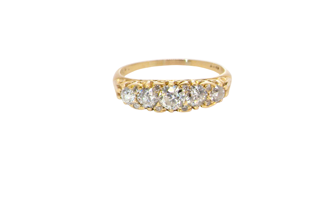 An antique boat shaped five stone ring. Set with five old cut white diamonds. Centre 5mm (0.45-0.50 carats) each side a 4mm stone, at each end a 2.4mm stone. Total diamond content estimated at one carat.