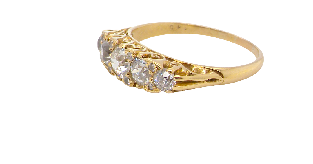 An antique boat shaped five stone ring. Set with five old cut white diamonds. Centre 5mm (0.45-0.50 carats) each side a 4mm stone, at each end a 2.4mm stone. Total diamond content one carat.