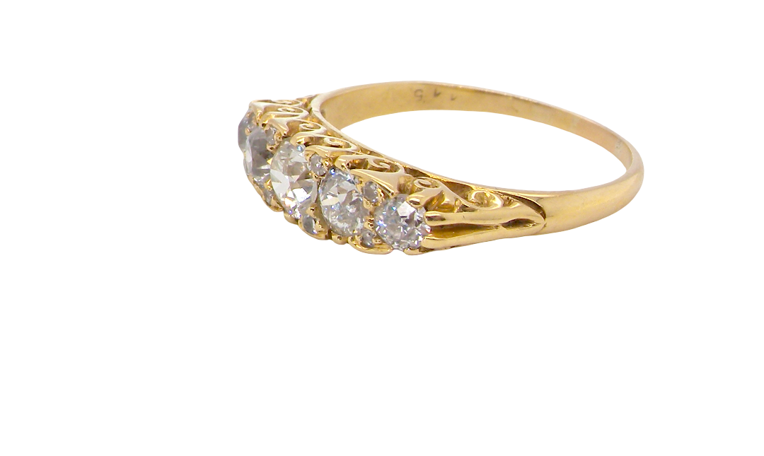An antique boat shaped five stone ring. Set with five old cut white diamonds. Centre 5mm (0.45-0.50 carats) each side a 4mm stone, at each end a 2.4mm stone. Total diamond content one carat.