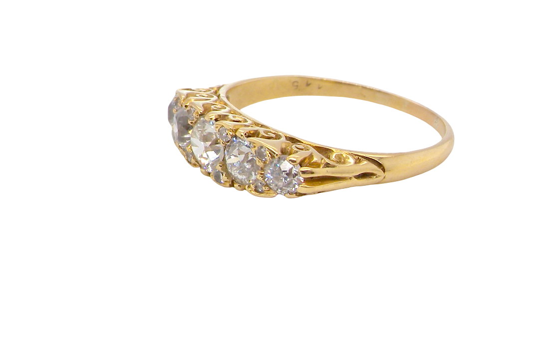 An antique boat shaped five stone ring. Set with five old cut white diamonds. Centre 5mm (0.45-0.50 carats) each side a 4mm stone, at each end a 2.4mm stone. Total diamond content one carat.