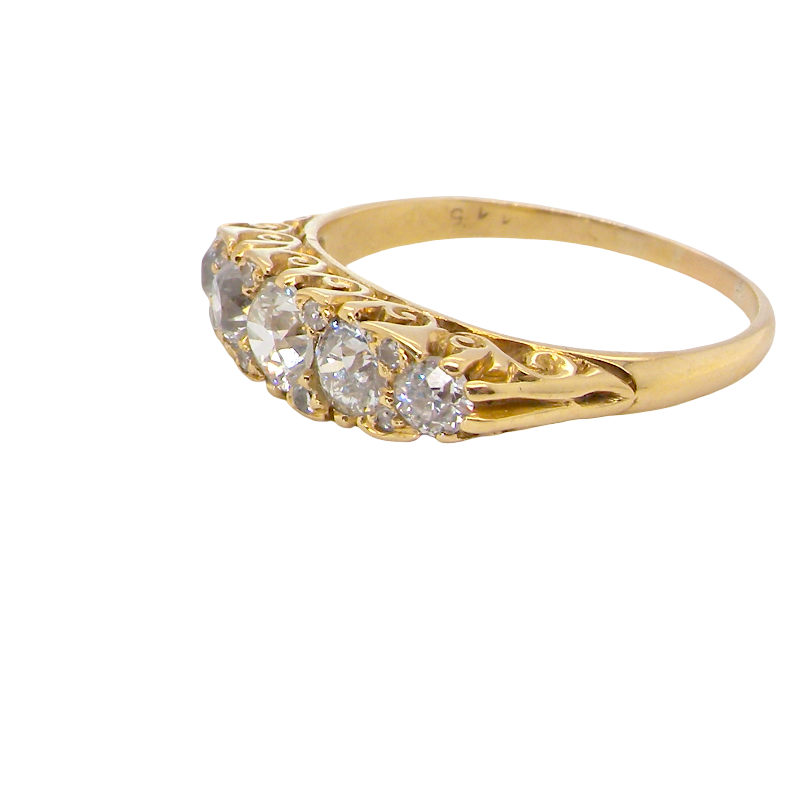 An antique boat shaped five stone ring. Set with five old cut white diamonds. Centre 5mm (0.45-0.50 carats) each side a 4mm stone, at each end a 2.4mm stone. Total diamond content one carat.