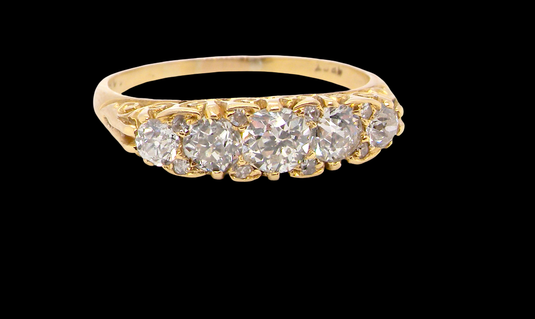 An antique boat shaped five stone ring. Set with five old cut white diamonds. Centre 5mm (0.45-0.50 carats) each side a 4mm stone, at each end a 2.4mm stone. Total diamond content estimated at one carat.