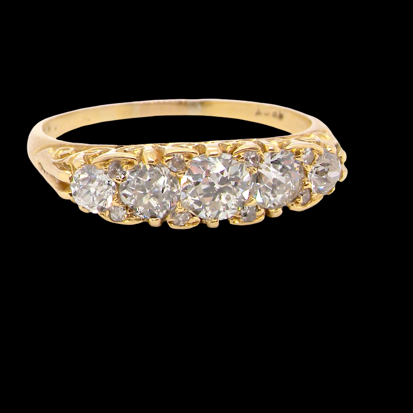 An antique boat shaped five stone ring. Set with five old cut white diamonds. Centre 5mm (0.45-0.50 carats) each side a 4mm stone, at each end a 2.4mm stone. Total diamond content estimated at one carat.