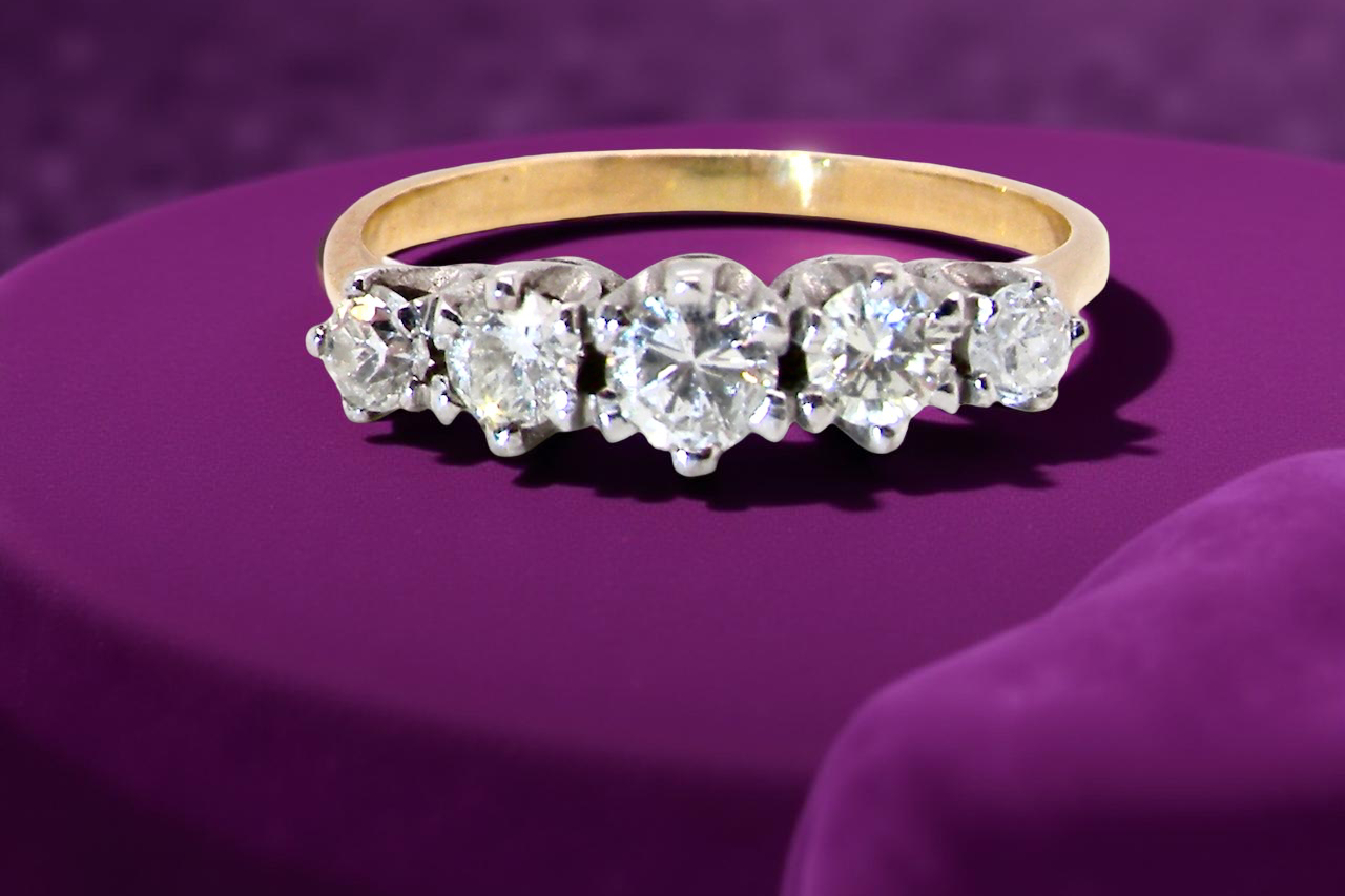 An antique five-stone ring from the early 20th century,