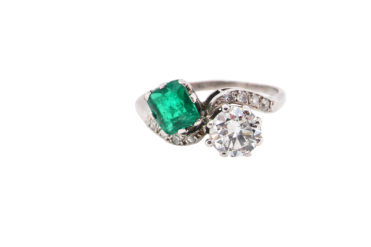 An antique two stone Emerald and Diamond ring