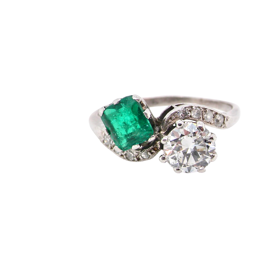 An antique two stone Emerald and Diamond ring