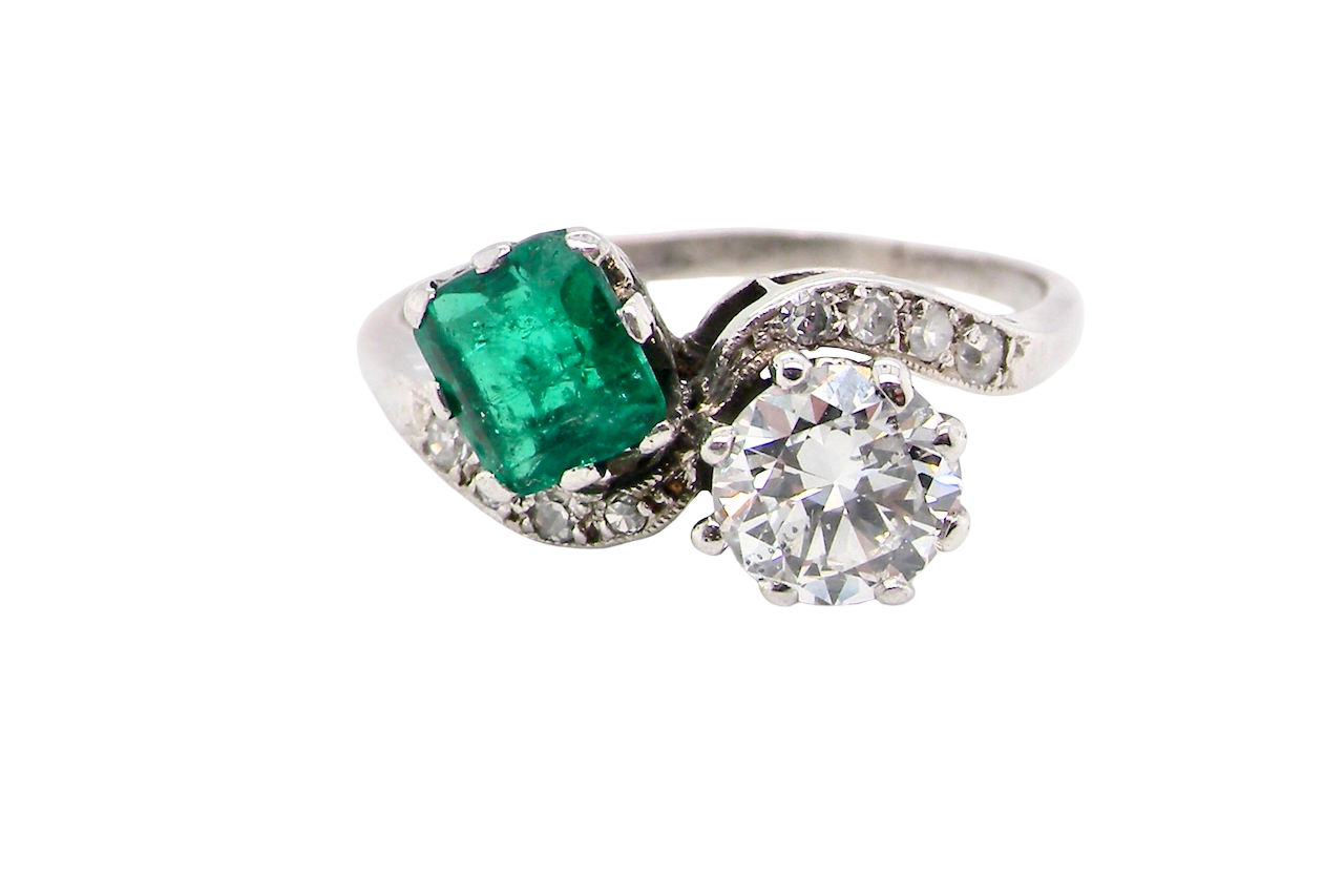 An antique two stone Emerald and Diamond ring