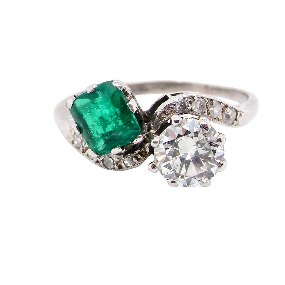 An antique two stone Emerald and Diamond ring