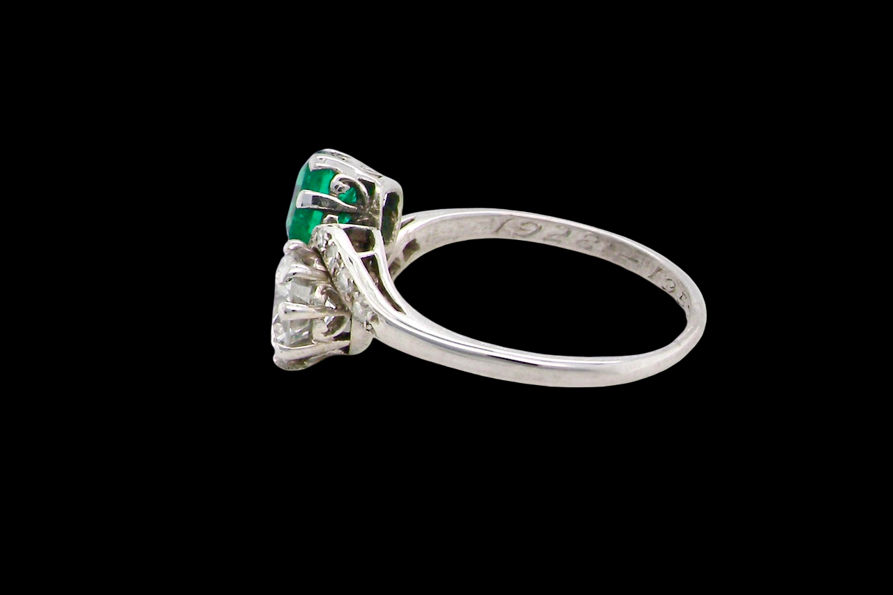 An antique two stone Emerald and Diamond ring
