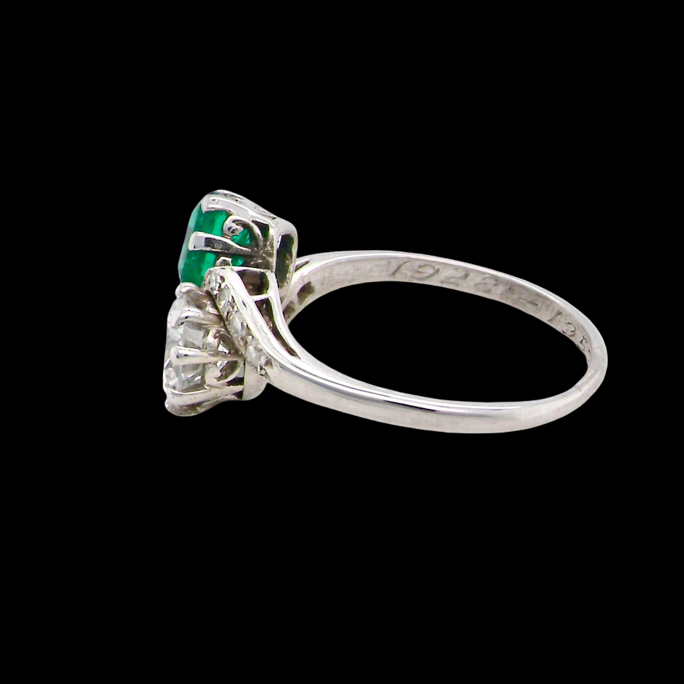 An antique two stone Emerald and Diamond ring