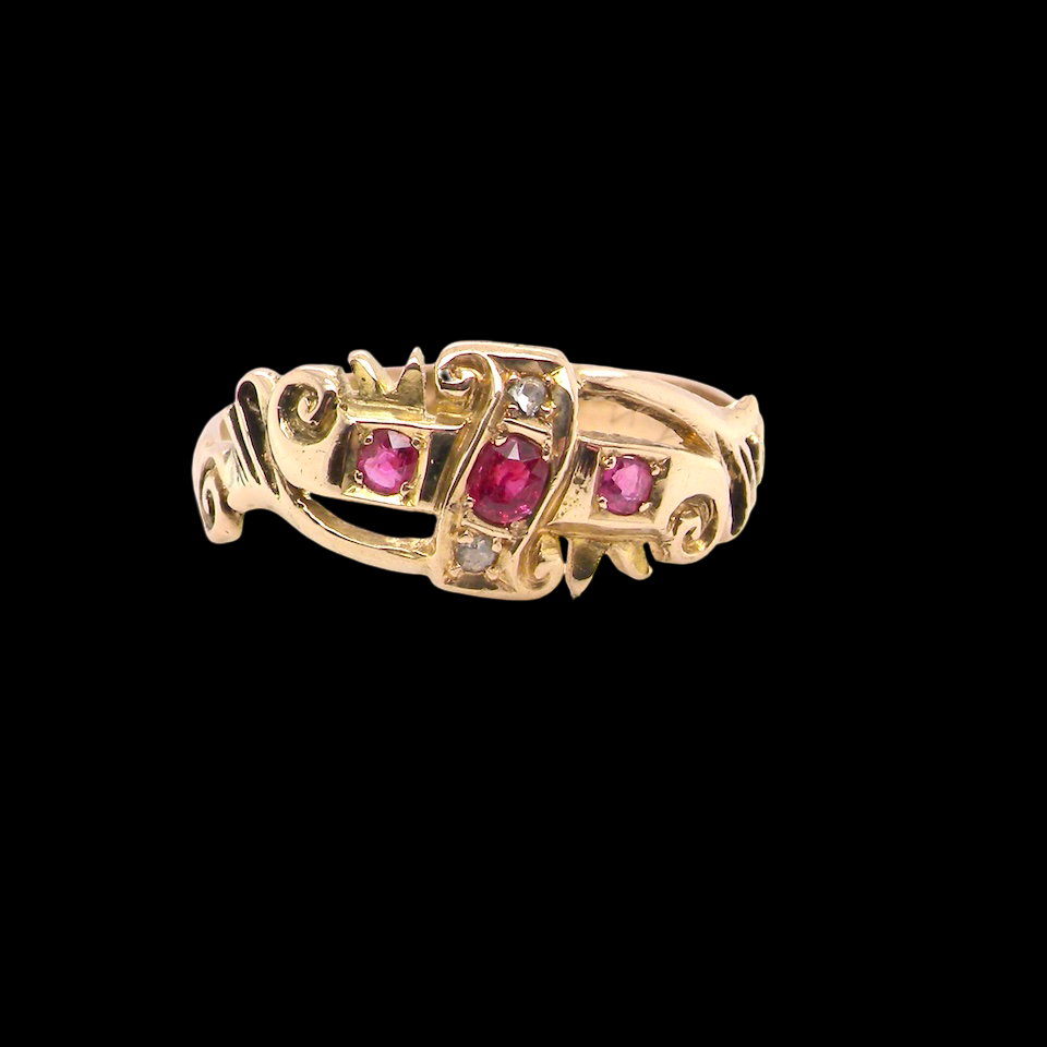 An early 20th century ring. 18 carat gold, set with three rubies. 1918