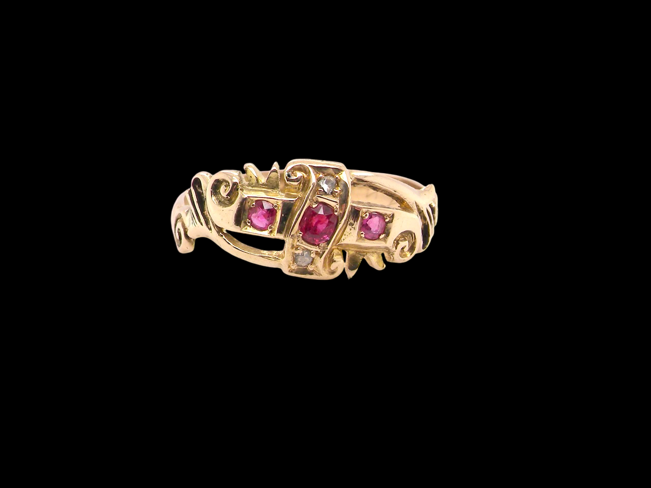 An early 20th century ring. 18 carat gold, set with three rubies. 1918