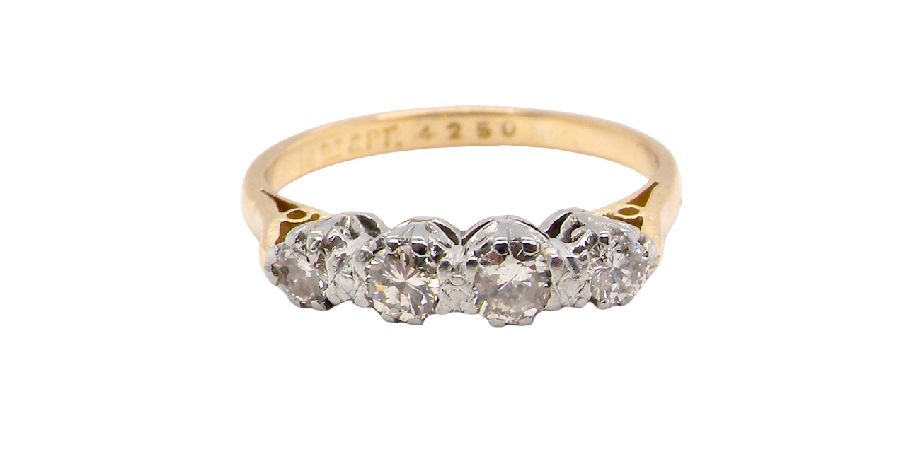 Gold ring with diamonds on a white background