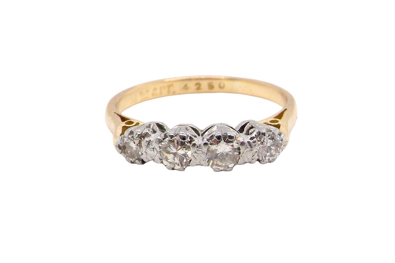 Gold ring with diamonds on a white background
