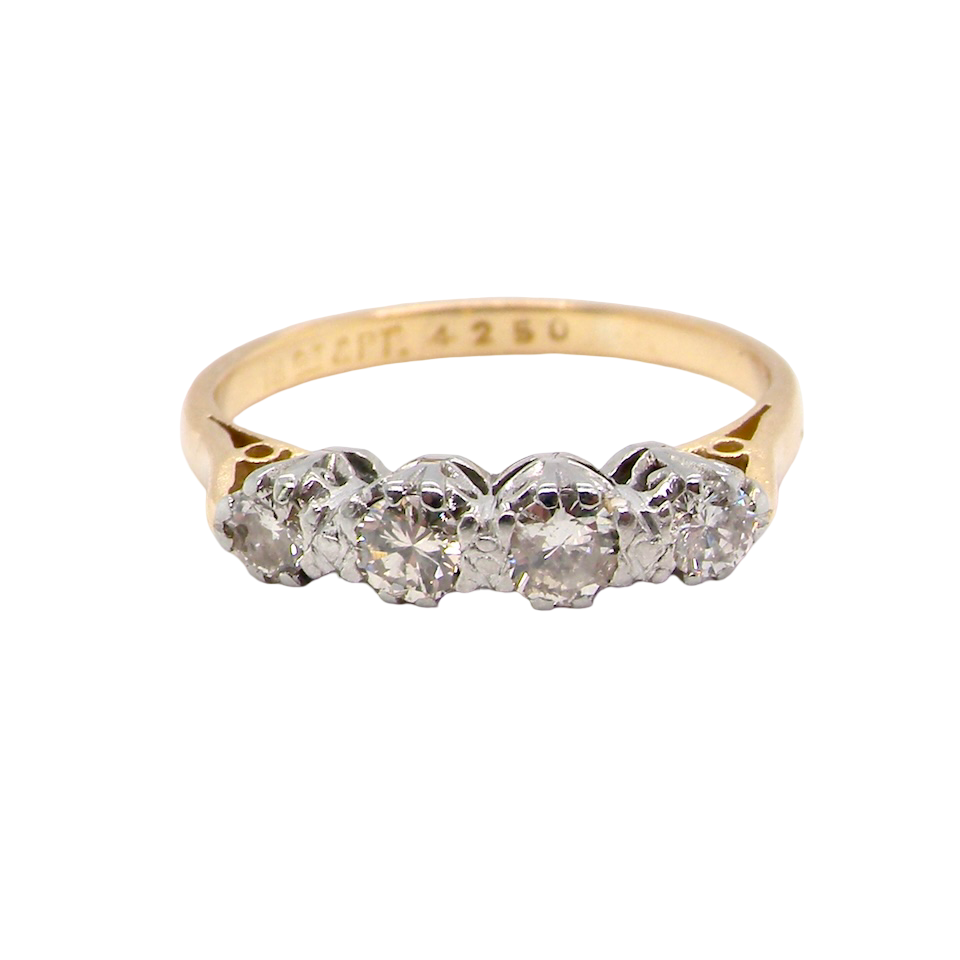 Gold ring with diamonds on a white background