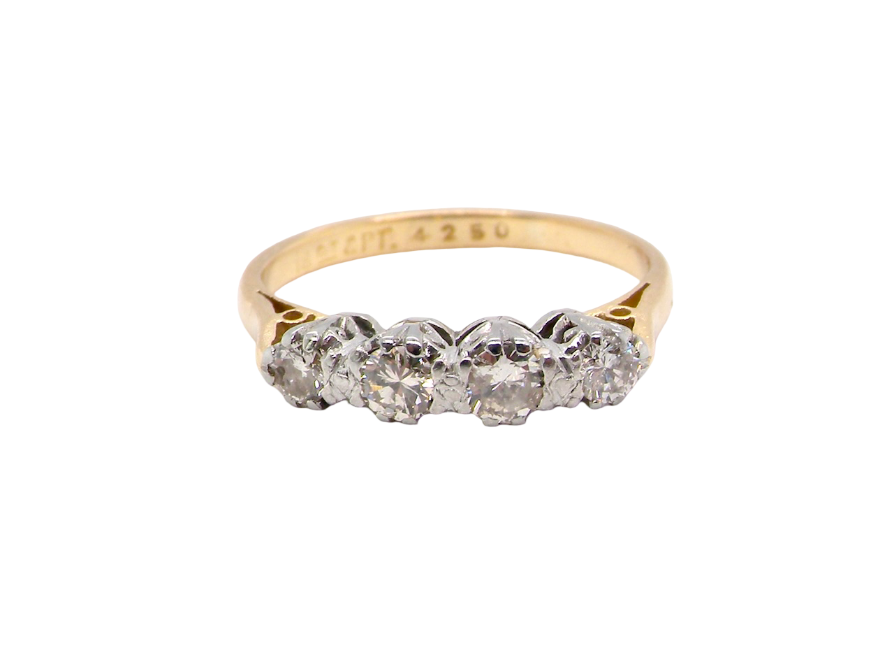 Gold ring with diamonds on a white background