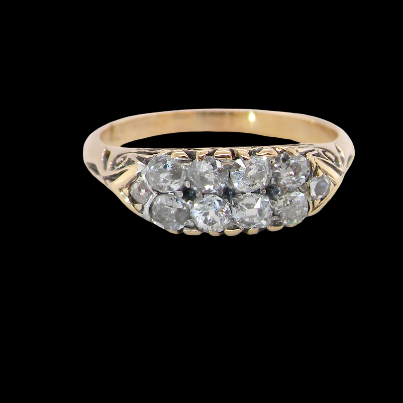 An eight stone boat shaped diamond ring, with two extra 'accent' diamonds