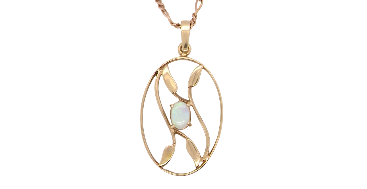 An elegant Art Deco style pendant featuring a beautiful oval opal measuring 6 × 4 mm,