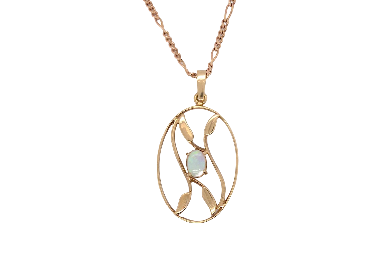 An elegant Art Deco style pendant featuring a beautiful oval opal measuring 6 × 4 mm, displaying a lovely play of colour.