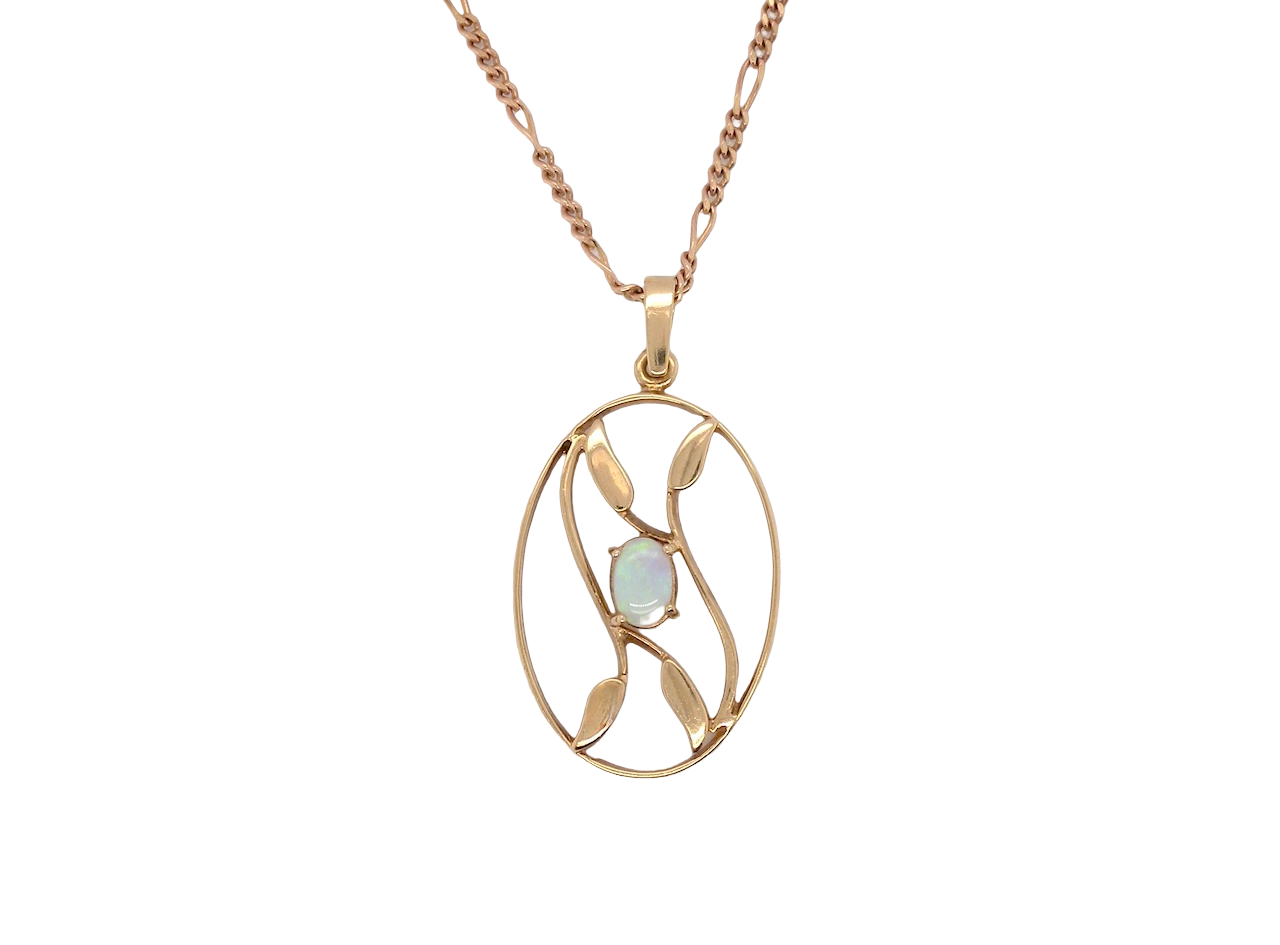An elegant Art Deco style pendant featuring a beautiful oval opal measuring 6 × 4 mm, displaying a lovely play of colour.