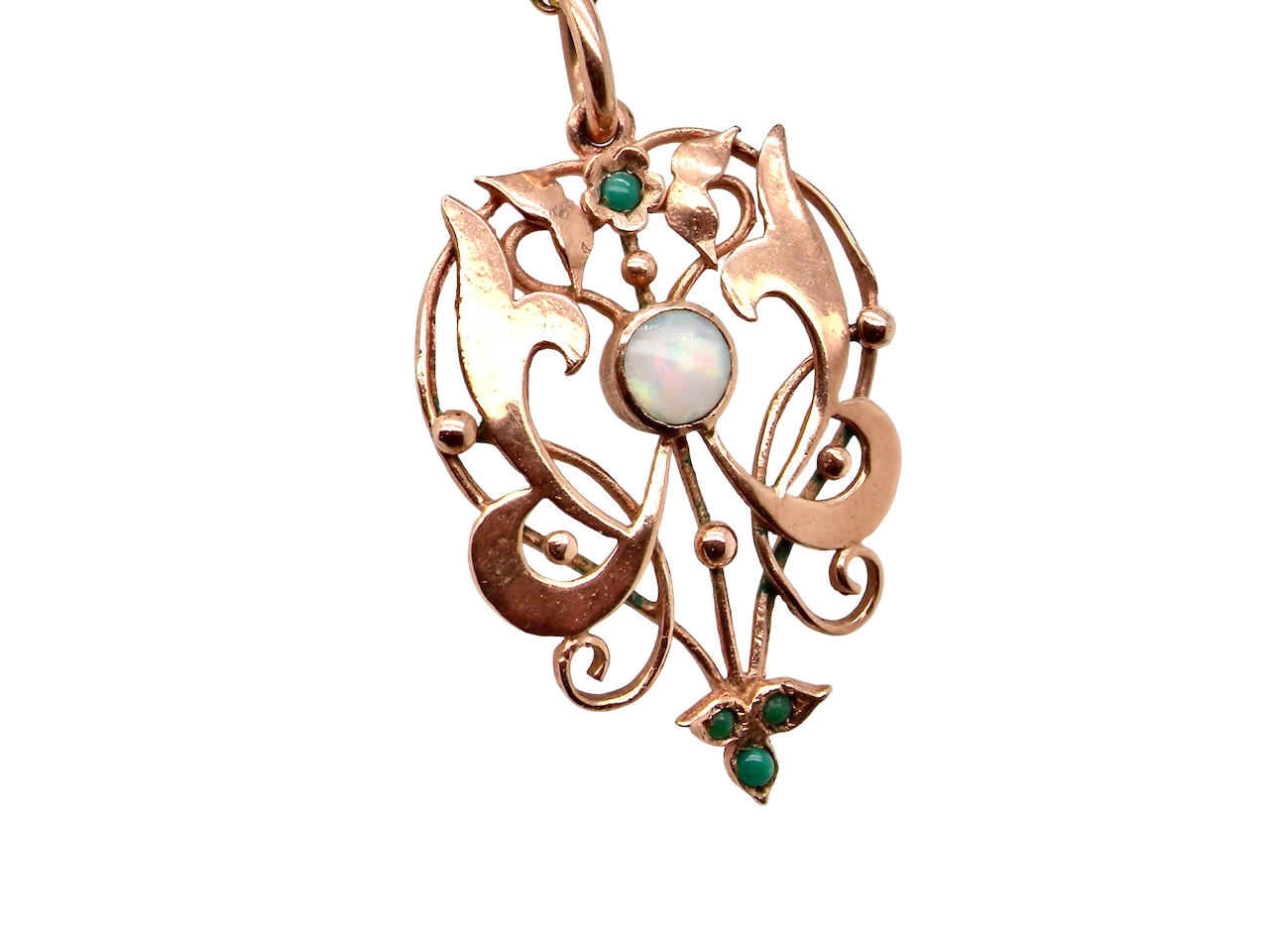 close view An elegant Edwardian-style pendant featuring a fancy openwork design, set with a round 5mm opal centre stone.