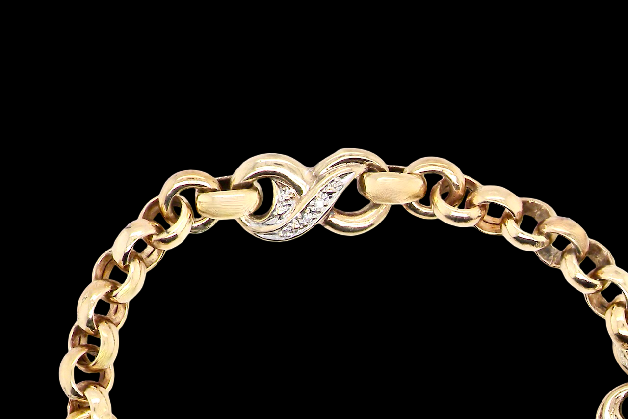 close view An elegant and wearable 9 carat gold bracelet featuring distinctive diamond-set “kiss” style links, beautifully balanced with classic belcher connectors.
