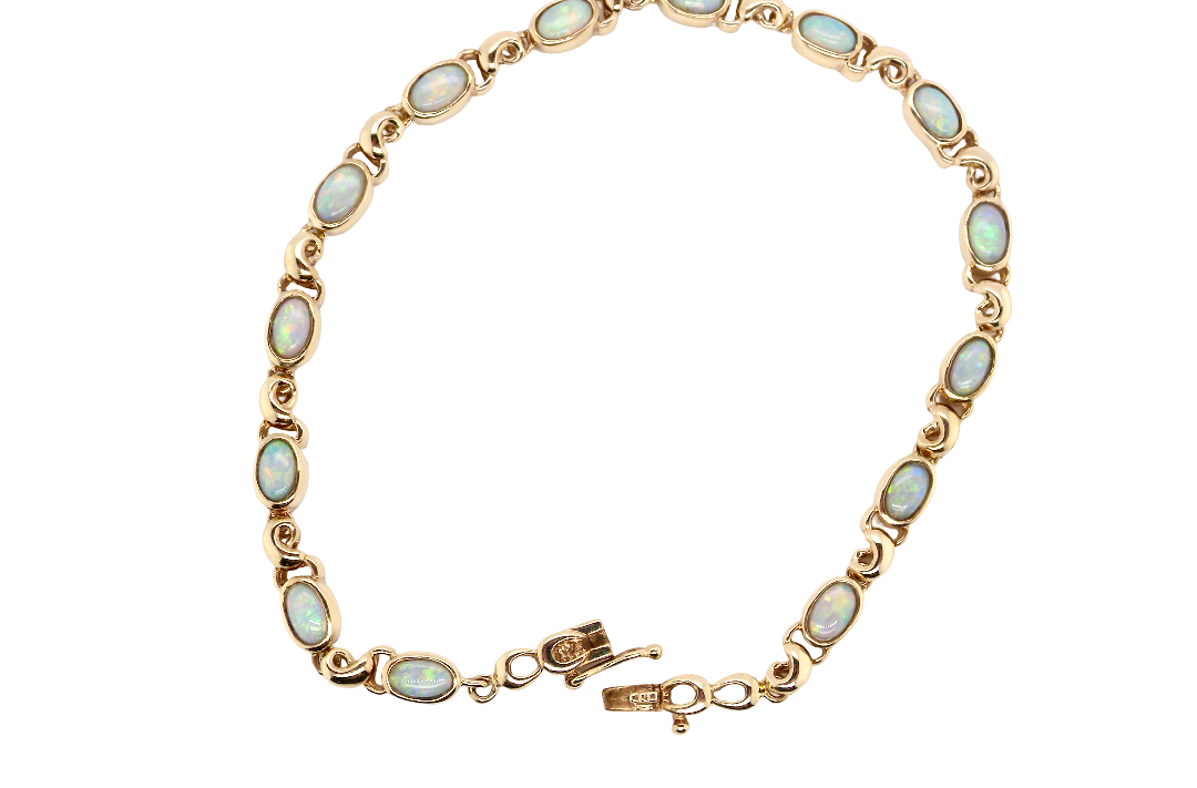 An elegant line bracelet set with fourteen oval opals, each measuring approximately 5 x 3 mm, displaying a pleasing and lively play of colour.