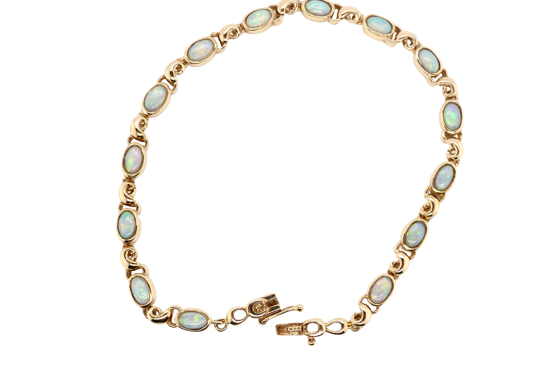 An elegant line bracelet set with fourteen oval opals, each measuring approximately 5 x 3 mm, displaying a pleasing and lively play of colour.