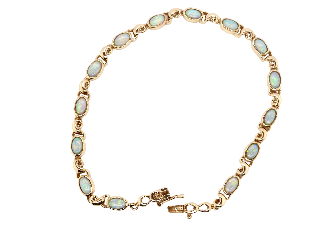 An elegant line bracelet set with fourteen oval opals, each measuring approximately 5 x 3 mm, displaying a pleasing and lively play of colour.