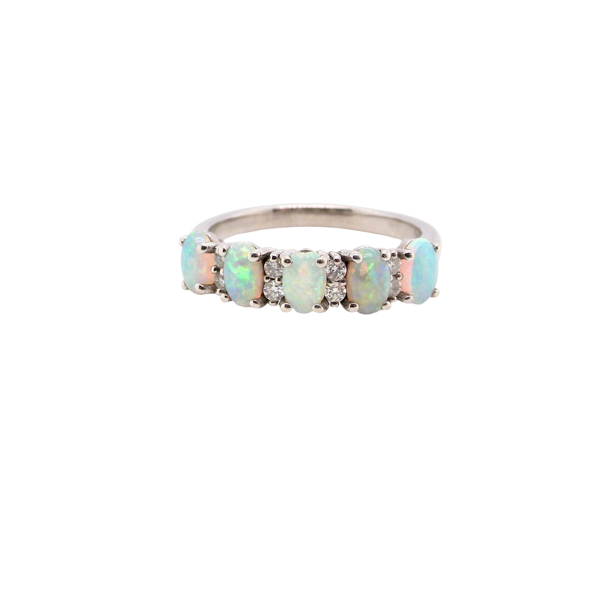An elegant opal and diamond half hoop ring, featuring five oval opals with lively play of colour. Each opal measures 5 x 3mm, with an estimated total opal weight of approximately 0.75 carats, all claw set to maximise light and colour.