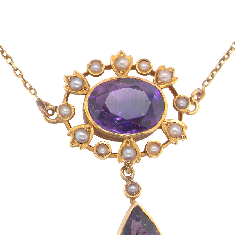 An elegant pendant from the late part of the 19th century. This Victorian pendant features two amethyst gemstones,